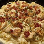 Creamy Chicken Bacon Fettuccine in a cast iron skillet